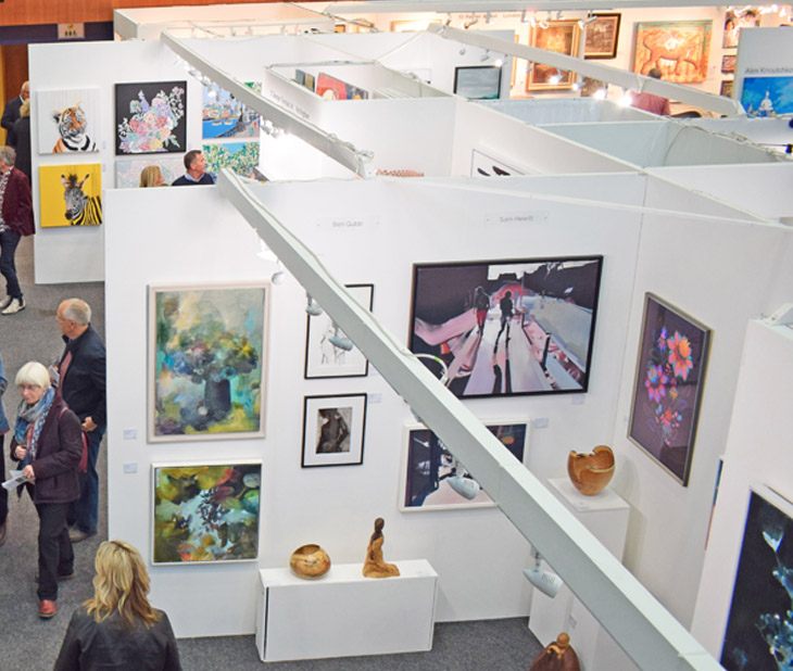 Visitors and art on display at the Private View of Fresh: Art Fair 2019 at Cheltenham Racecourse.