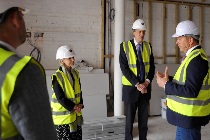 Phil Brace, Chief Executive of The Little Princess Trust, gives the Lord-Lieutenant to Herefordshire, Edward Harley, and his wife Victoria a tour of The Hannah Tarplee building as work progresses on the charity's new headquarters. 