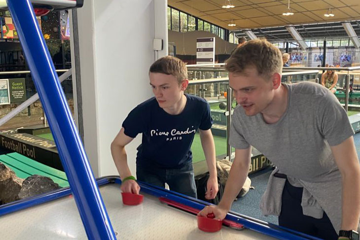 The air hockey was quite competitive when Ryan Birch and James Lovering teamed up.