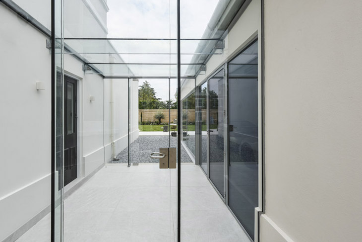 Glass link between garage and main house