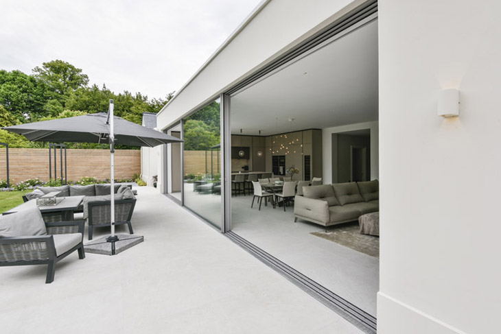 Contemporary extension to Georgian property, designed by RRA Architects. Showing large sliding, glass doors by IQ Glass.