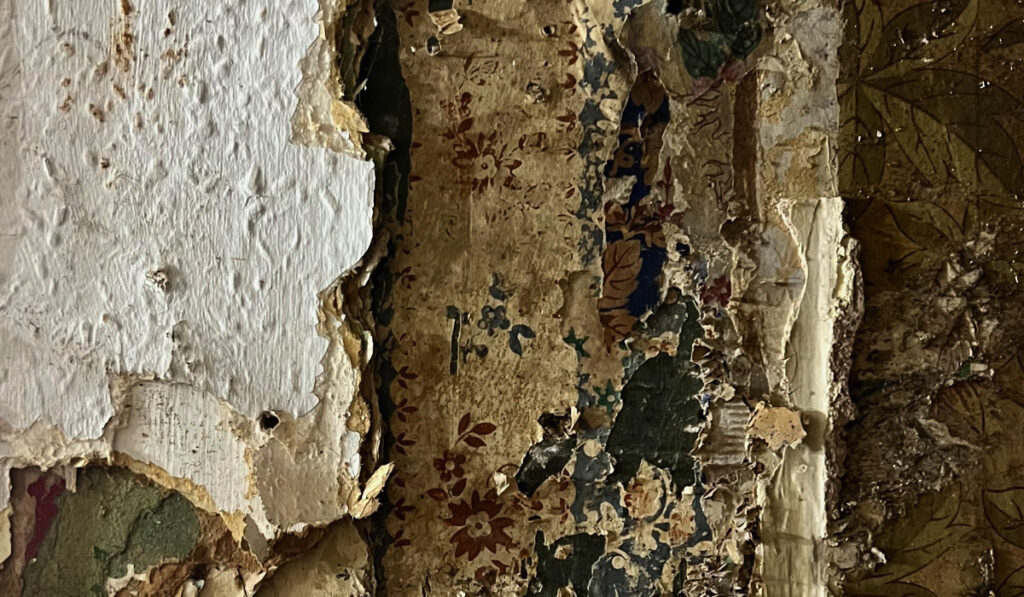 Layers of centuries old wallpaper that was revealed during the restoration works.