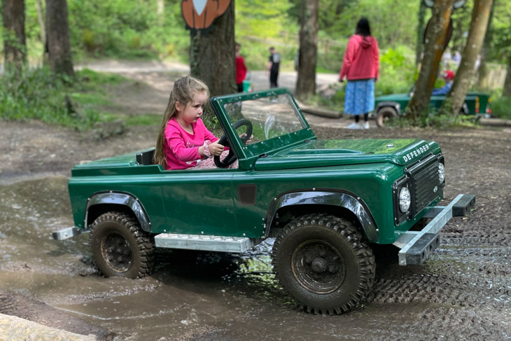 A very determined driver enjoying the mini Land Rover experience at Center Parcs - sadly only for children.